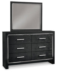 Kaydell King Upholstered Panel Headboard with Mirrored Dresser, Chest and 2 Nightstands - furniture place usa