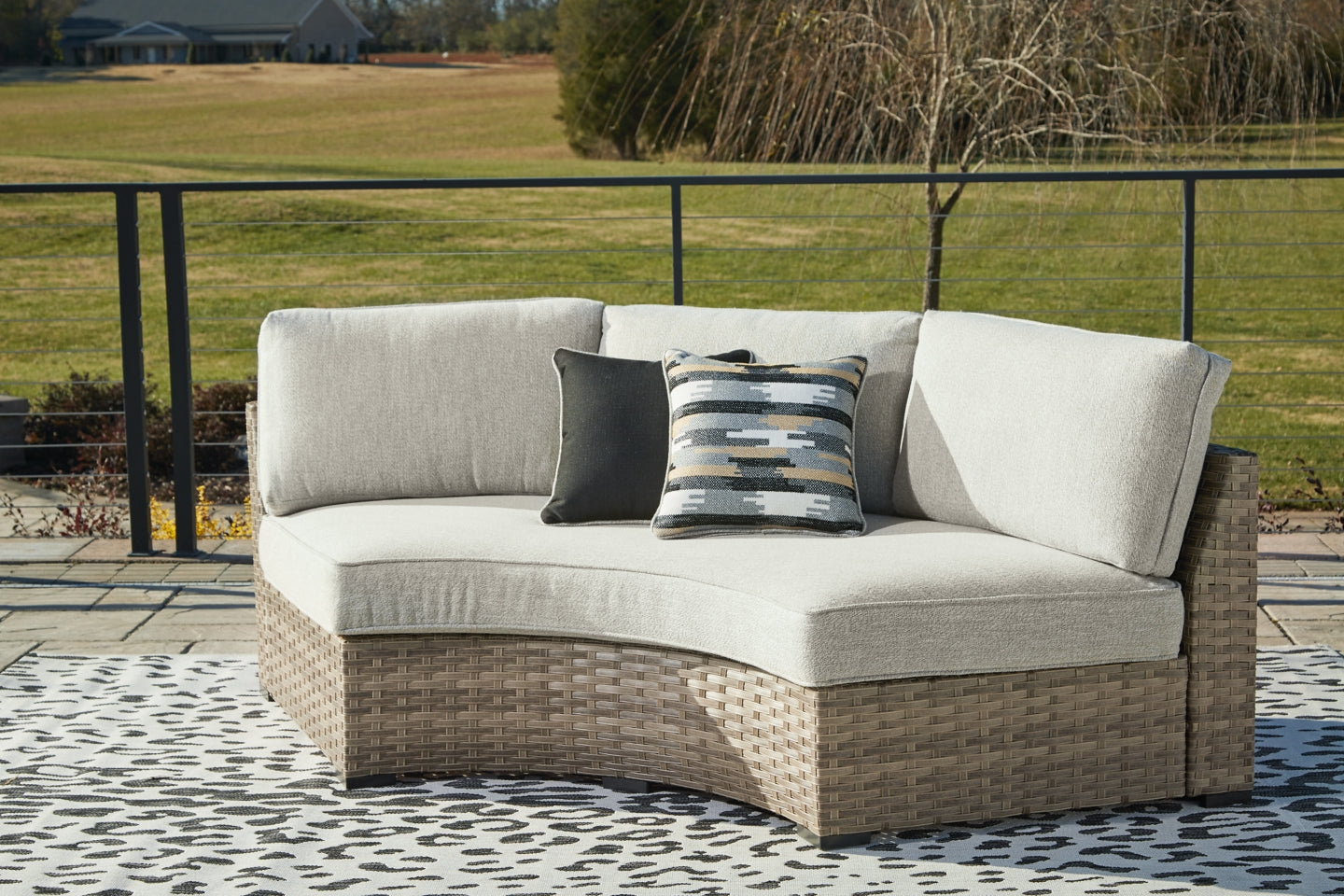 Calworth Outdoor Curved Loveseat with Cushion - furniture place usa