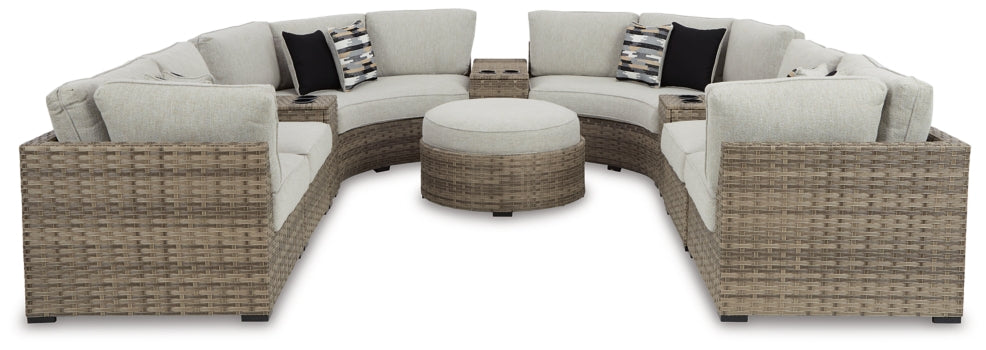 Calworth Outdoor 9-Piece Sectional with Ottoman - furniture place usa